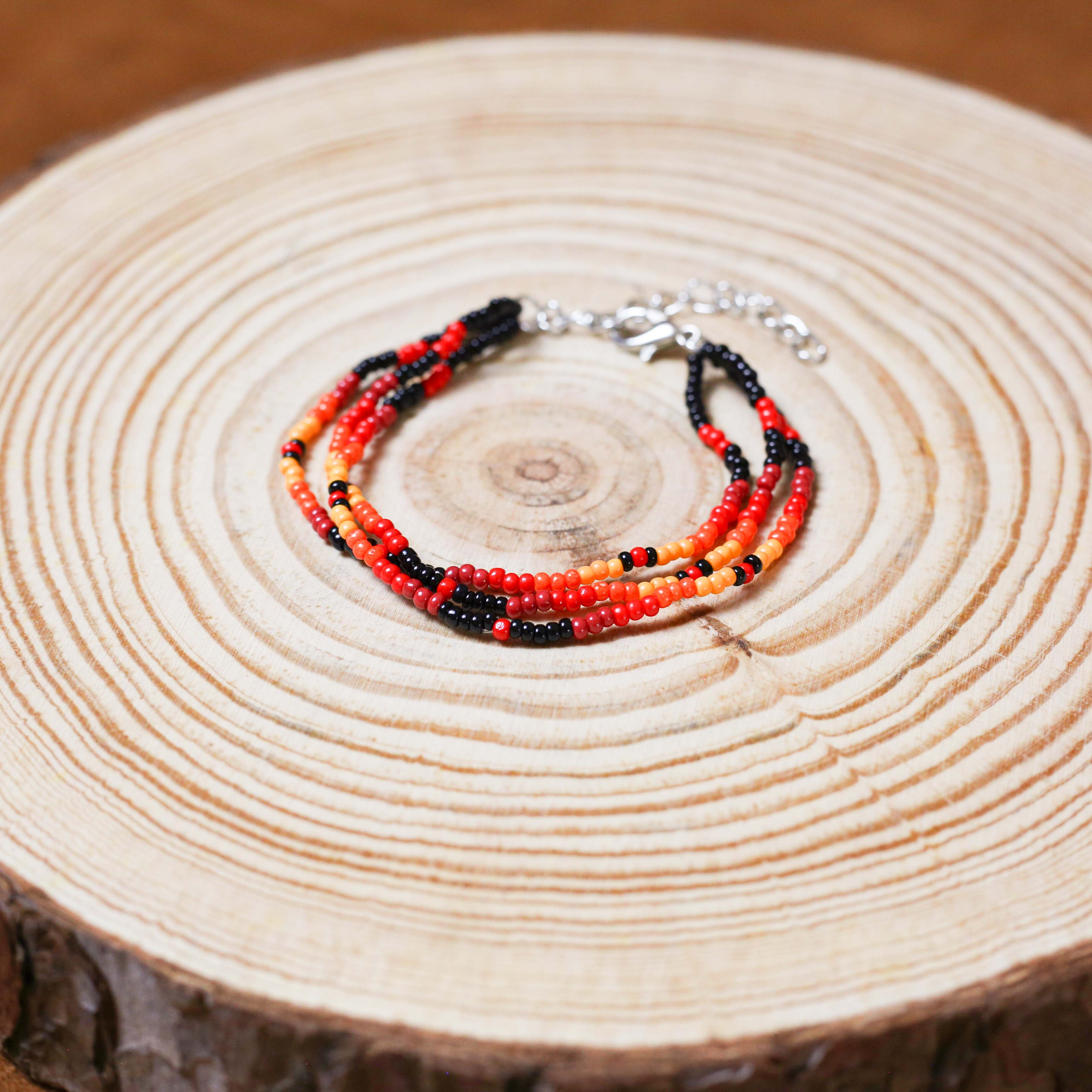 Sunset Harmony Beaded Bracelet – Bold Red, Orange, Yellow, and Black Strands