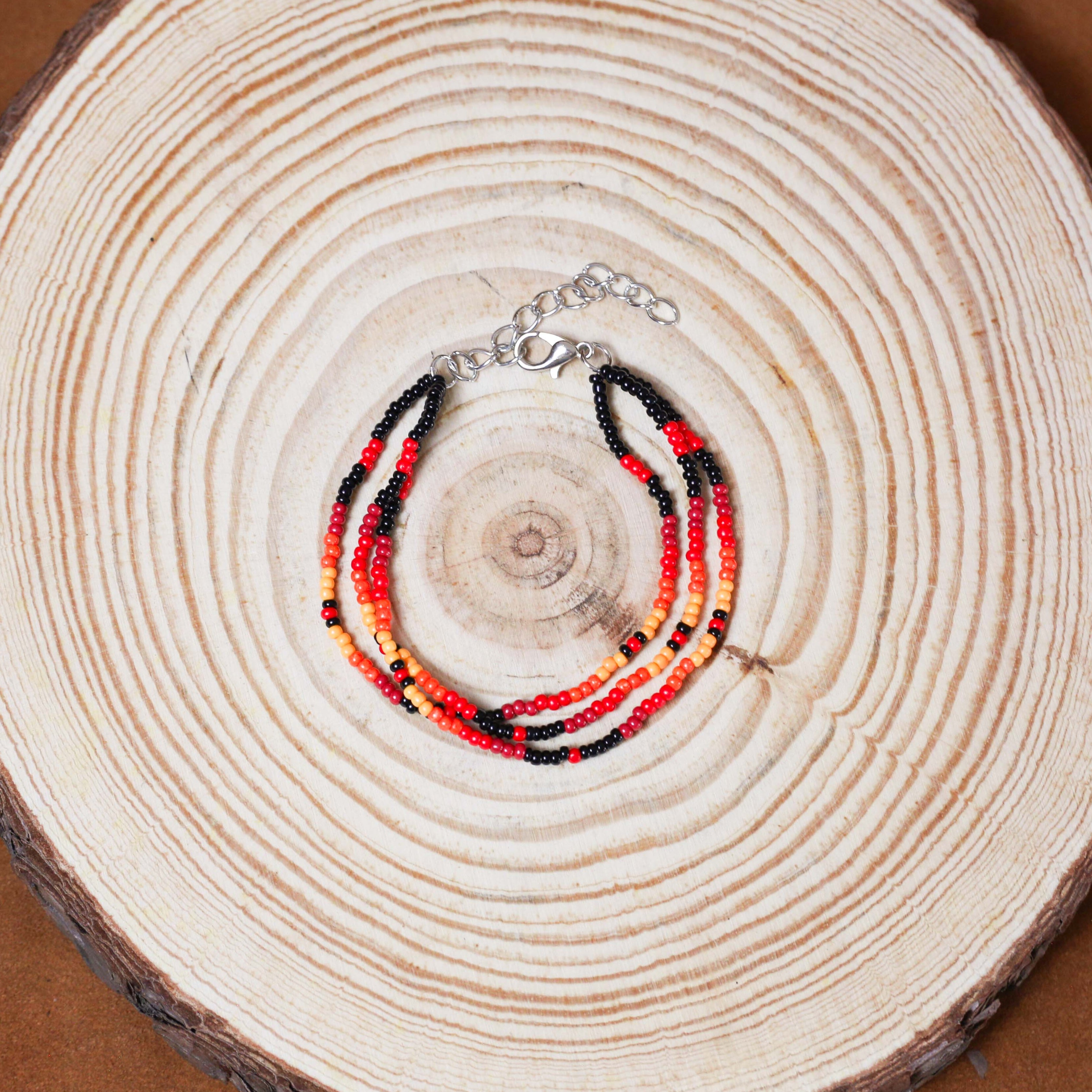 Sunset Harmony Beaded Bracelet – Bold Red, Orange, Yellow, and Black Strands