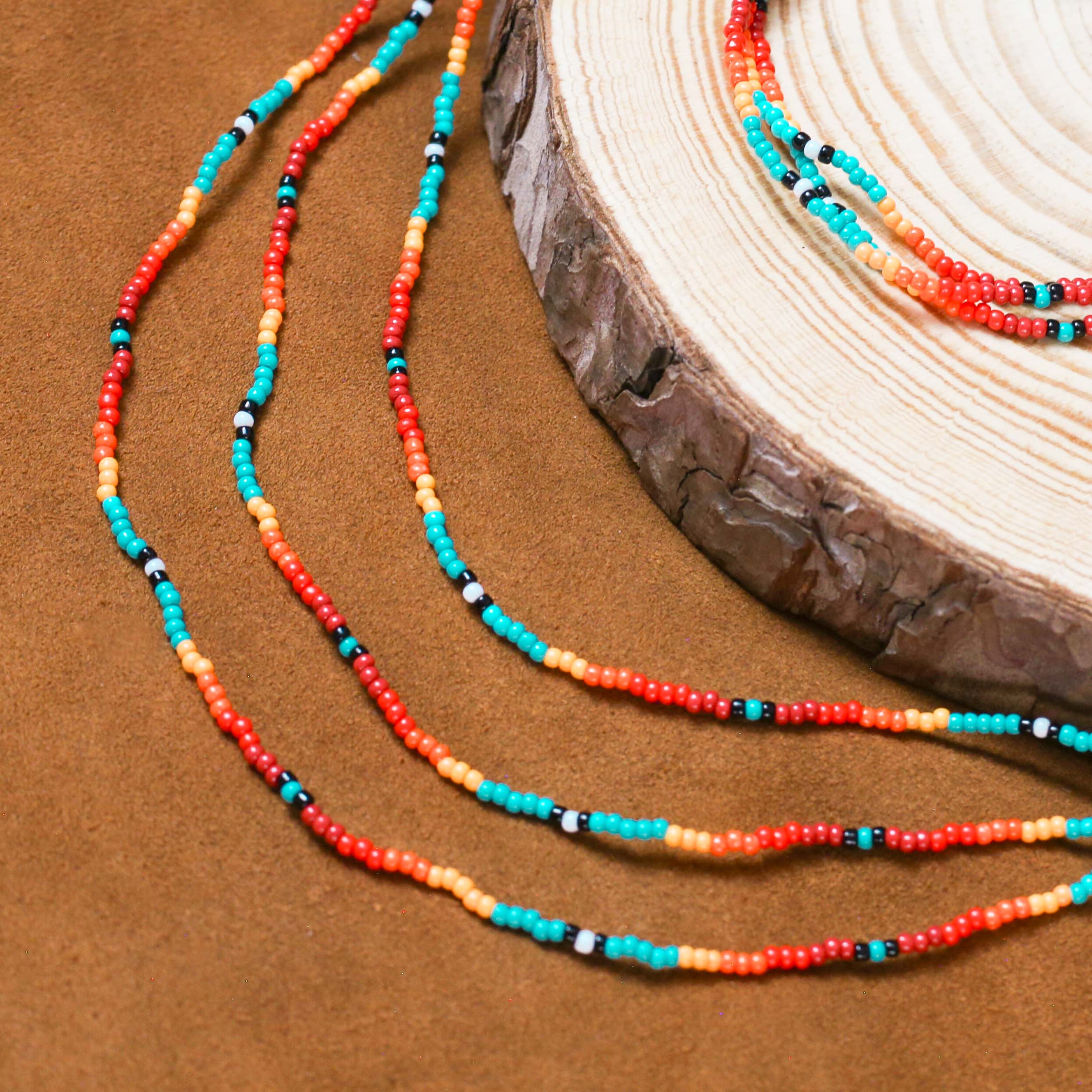 Sunset Glow Beaded Necklace – Multi-Strand with Red, Orange, and Turquoise Beads